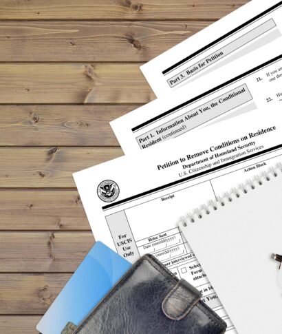 USCIS form I-751 Petition to remove conditions on residence lies on flat lay office table and ready to fill. U.S. Citizenship and Immigration services paperwork concept. Top view